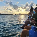 Group enjoying a sunset boat ride