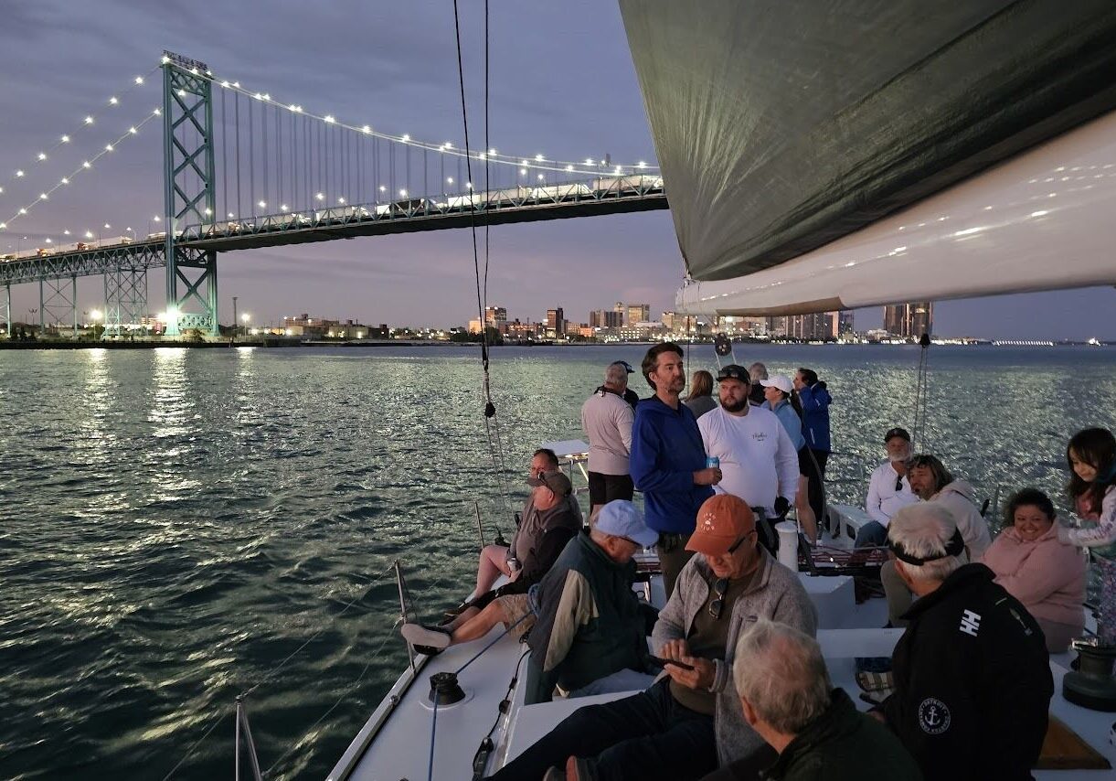 Detroit skyline after dark viewed from a sailing yacht