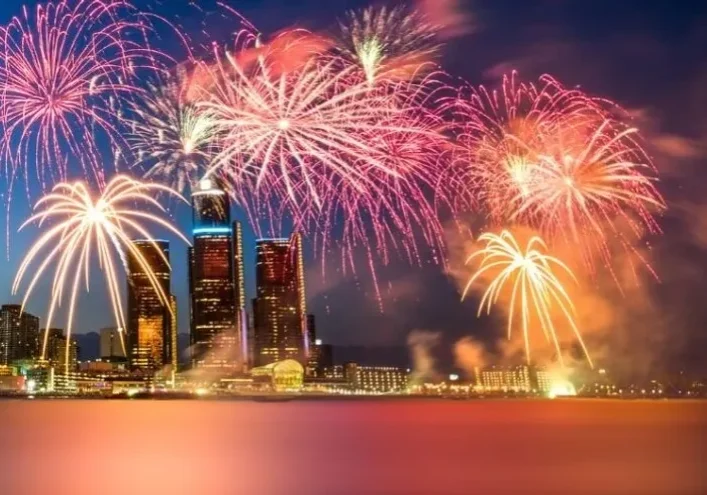 Fireworks over city skyline at night